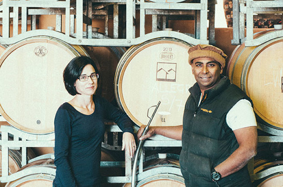 Former scientists Maree Collis and Ray Nadeson in the barrel room at Lethbridge Wines.