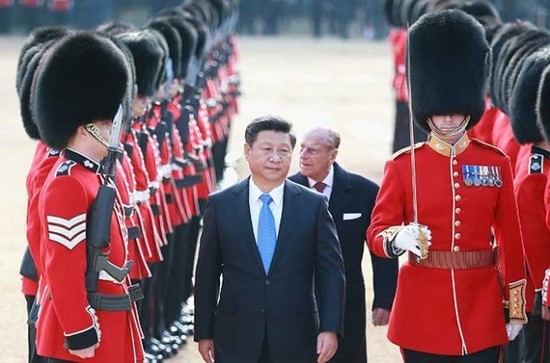 Chinese president Xi Jinping gets a Royal welcome in the UK. Prince Philip is in the background.