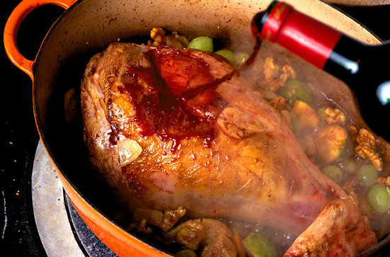 Leg of Lamb Slow Cooked in Red Wine with Figs, Walnuts and Grapes