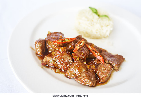 Cut beef in oyster sauce with rice. Credit: Evgheni Lachi / Alamy Stock Photo