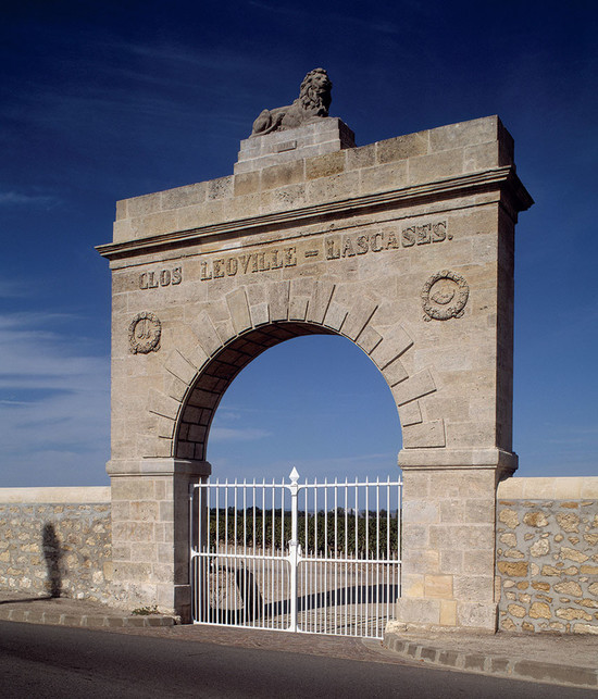 Image: a stone lion guards the entrance of Léoville-Las Cases