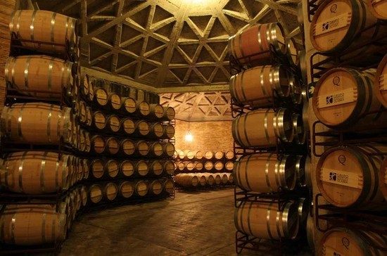 Wine barrels at Bodegas Olarra in Rioja Alta, Spain