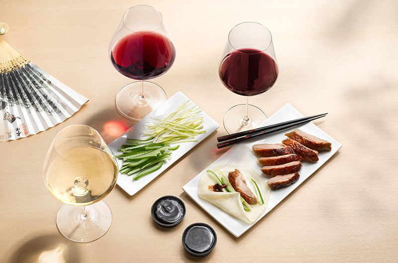 Why do Austrian wines pair well with Asian cuisine?